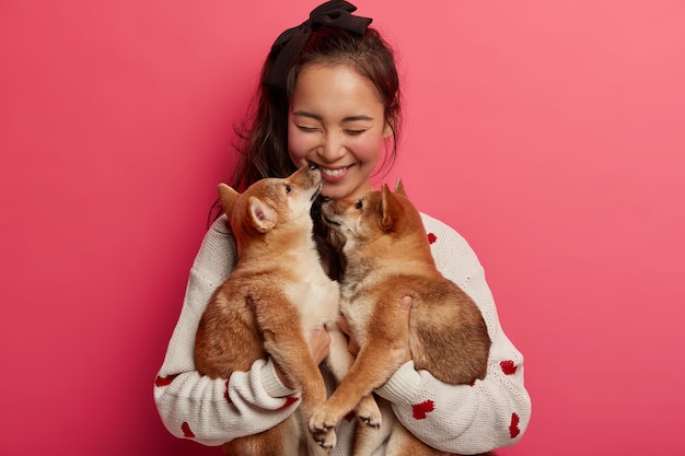 Cheerful Girl Celebrating Her Birthday with Two Pedigree Puppies – Free Stock Photo for Download