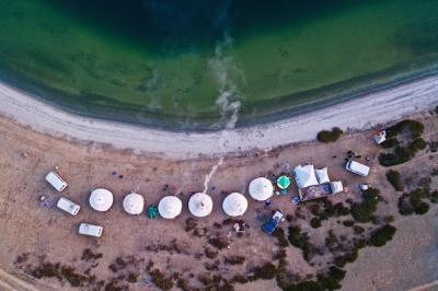 Aerial View of White Tents on a Beautiful Beach – Free Download