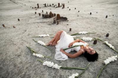 Brunette Girl in White Dress Surrounded by Gladioluses on the Seacoast – Free Stock Photo, Download for Free