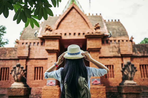 Back View of a Young Asian Backpacker Woman at an Ancient Temple – Free Download