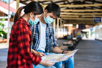 Male and Female Tourists Exploring a Map Beside the Railway – Free Stock Photo, Download Free Stock Photo