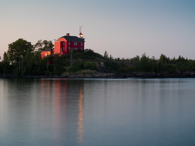 Scenic Lake Landscape with a Red House – Free Stock Photo for Download