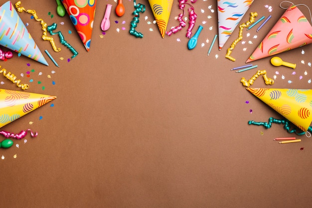 Birthday Themed Background: Array of Objects on a Brown Backdrop – Free Download