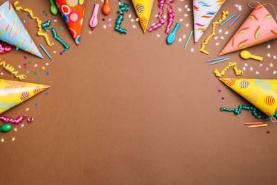 Birthday Themed Background: Array of Objects on a Brown Backdrop – Free Download