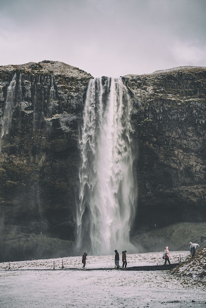 Stunning Images of People Near Waterfalls – Free to Download