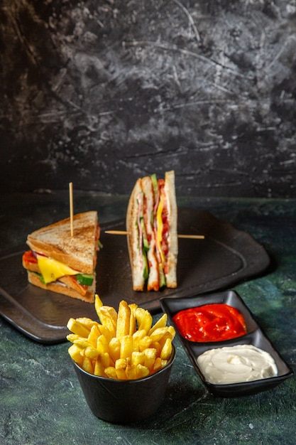 Tasty Ham Sandwiches with French Fries on Dark Surface – Free Download