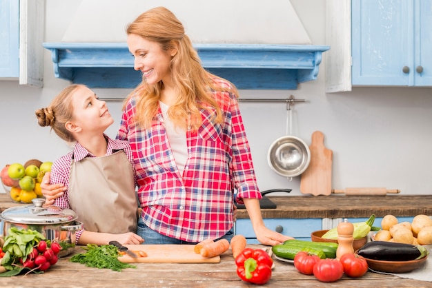 Close-Up of a Mother and Daughter Bonding Over Colorful Vegetables – Free Download