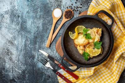 Top View of Fried Fish with Lemon and Parsley, Salt, and Pepper in Wooden Spoons – Free Download