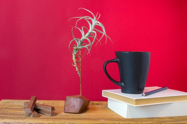 Book, Cup of Tea, Chocolate Coffee, and Plant on Wooden Background – Free Stock Photo for Download