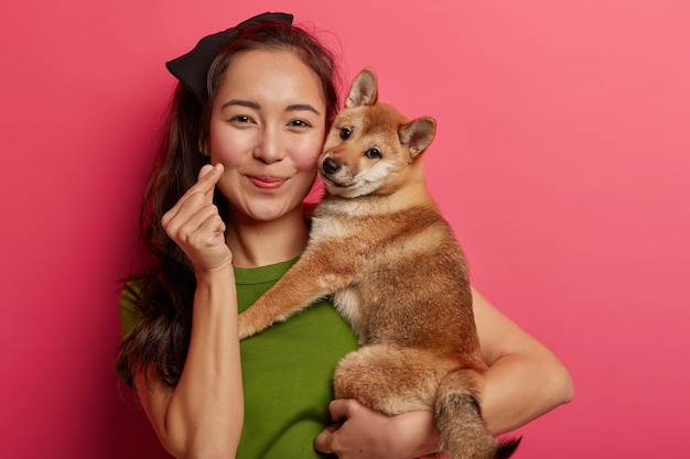 Portrait of a Pretty Asian Woman with Her Japanese Pedigree Hunting Dog – Free Stock Photo for Download