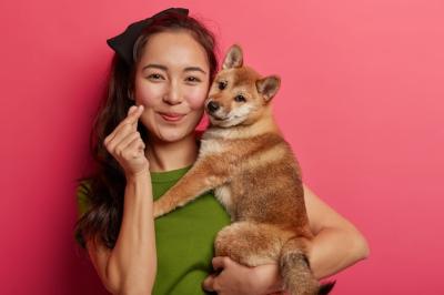 Portrait of a Pretty Asian Woman with Her Japanese Pedigree Hunting Dog – Free Stock Photo for Download