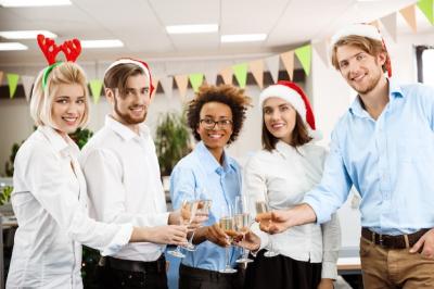 Colleagues Celebrating Christmas Party in Office with Champagne – Free to Download