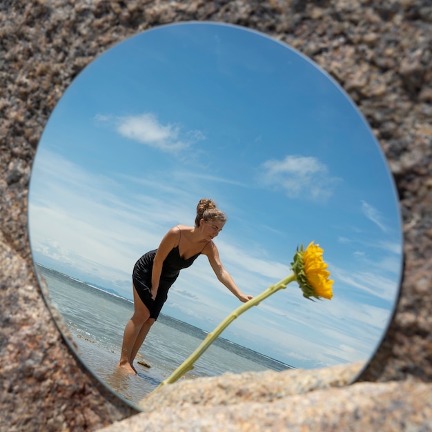 Woman Posing with Round Mirror and Flower – Free Download