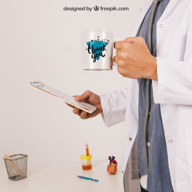 Doctor Holding Coffee Mug and Clipboard Mockup – Free Download