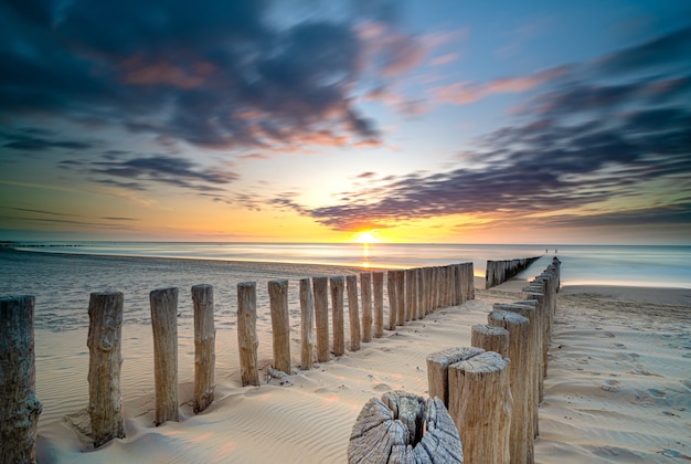 High Angle Shot of a Wooden Deck on the Seashore at Sunset – Free Download