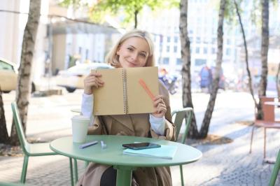 Beautiful Young Woman Writing in Outdoor Cafe – Free Stock Photo, Download Free