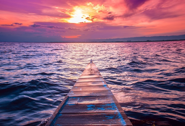 Small Boat Sailing in the Sea Under Stunning Red Sky – Free Stock Photo, Download Free