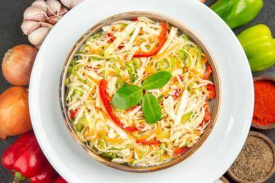 Delicious Vegetable Salad with Seasonings and Fresh Ingredients on a Grey Background – Free Download
