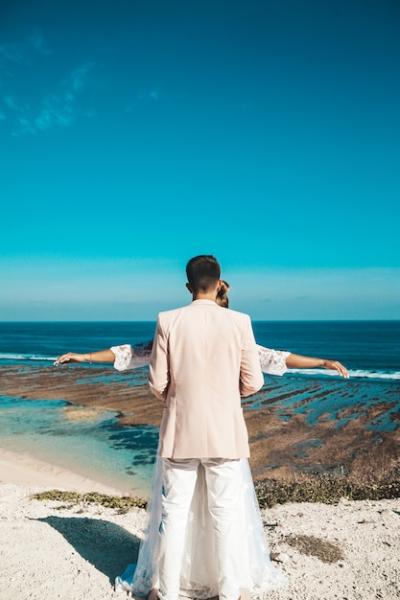 Stunning Bride and Groom Against Blue Sky and Sea – Free Stock Photo for Download