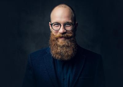 Redhead Bearded Male in Elegant Wool Suit Against Grey Background – Free Stock Photo for Download