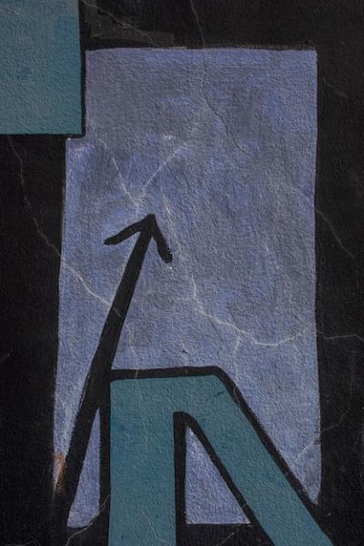Black Painted Arrow on a Graffiti Wall – Free Stock Photo for Download