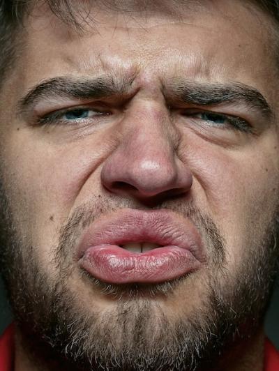 Close-Up Portrait of a Young Caucasian Man Expressing Emotion – Free Download