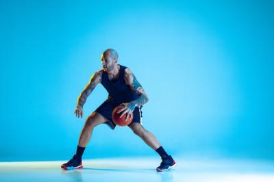 Young Basketball Player Training in Neon Light – Free Download