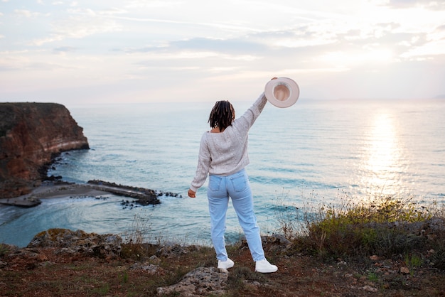 Full Shot of a Woman Holding a Hat – Free Download