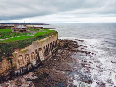 Coastline with Green Lawn and Cloudy Sky – Free Stock Photo for Download