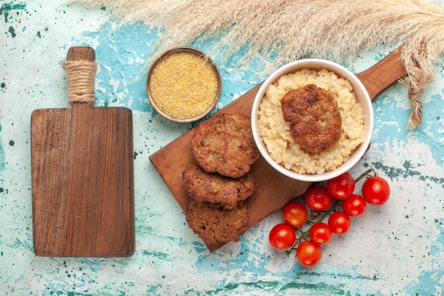 Red Cherry Tomatoes and Meat Cutlets on Light-Blue Surface – Free Stock Photo, Download for Free