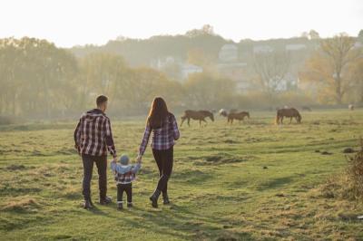 Cute Family Walking in a Sunset Summer Park – Free Download