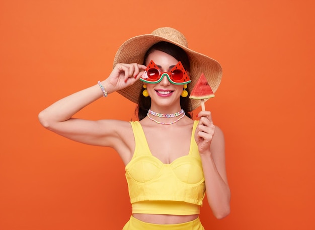 Happy Young Woman in Yellow Swimsuit and Wide Brim Hat – Free Download