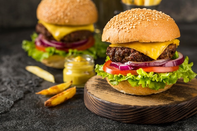 Close-up Beef Burgers on Cutting Board with Sauce – Free Stock Photo for Download