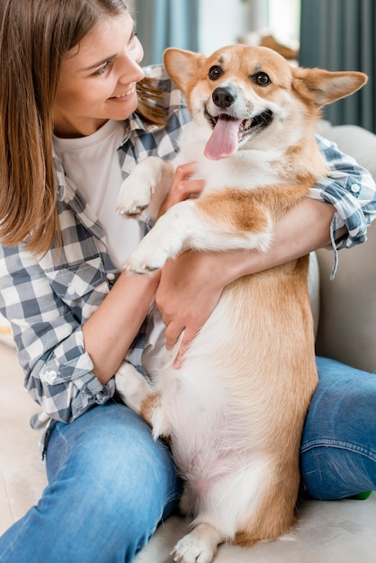 Smiling Woman Holding Dog – Free Download