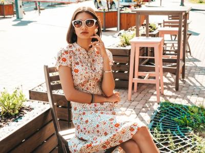 Beautiful Smiling Woman in Trendy Summer Sundress at Cafe – Free Download