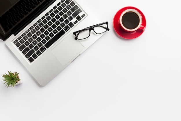 Cactus Plant, Coffee Cup, and Eyeglasses on Laptop Against a White Background – Free Stock Photo, Download Free