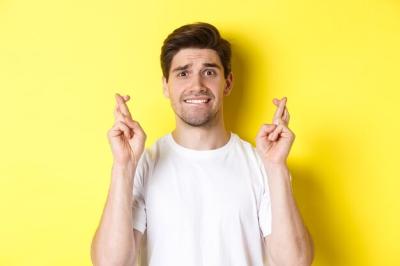 Closeup of Nervous Man Making a Wish with Fingers Crossed and Biting Lip – Free Stock Photo, Download Free