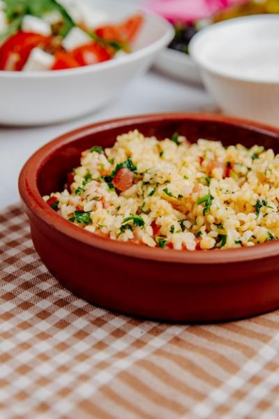 Side View of Bulgur with Tomatoes in a Wooden Bowl – Free Stock Photo for Download