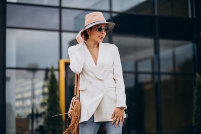 Young Woman in White Jacket Walking Outdoors – Free Stock Photo for Download