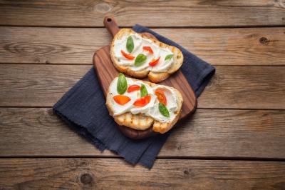 Delicious Bread with Cheese and Tomato on a Wooden Background – Free Download