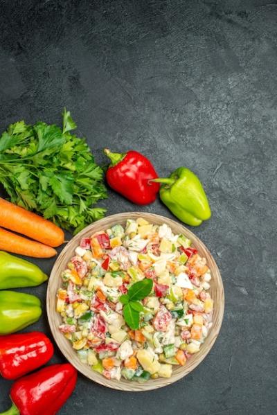 Bowl of Fresh Vegetable Salad with Carrots, Greens, and Bell Peppers – Free Download