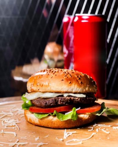 Side View of a Delicious Burger with Beef, Melted Cheese, and Fresh Vegetables – Free Stock Photo for Download