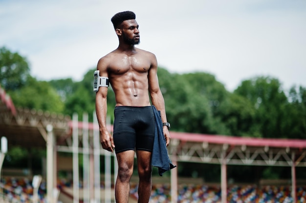 African American Male Athlete Posing at Stadium with Mobile Phone Arm Case – Free Download