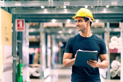 Indian Engineer in Safety Helmet Conducting Stock Check in Warehouse – Free Download