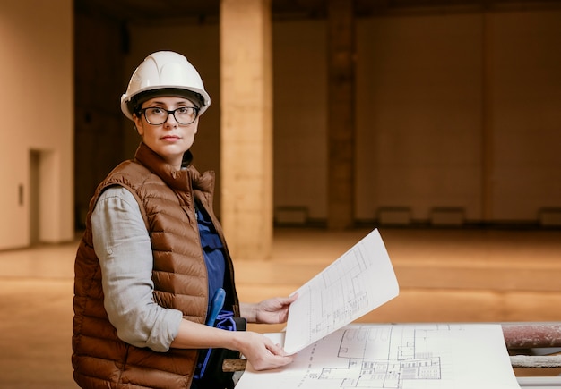 Medium Shot of a Woman Wearing a Helmet Indoors – Free Stock Photo Download