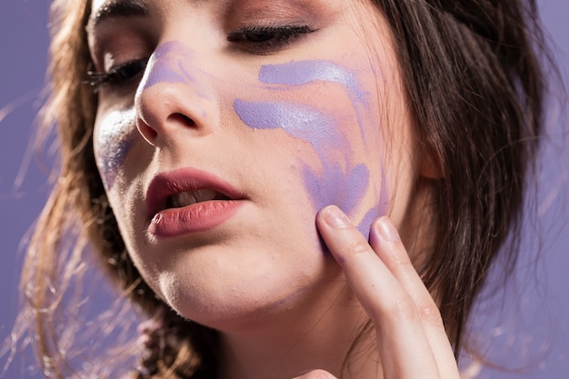 Woman Covering Herself with Paint as a Sign of Triumph – Free Stock Photo for Download