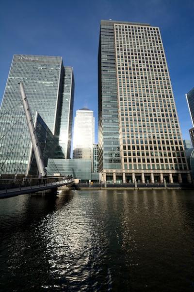 Tall Wedge Buildings Near Bridge Over Water on a Sunny Day – Free Stock Photo, Download for Free