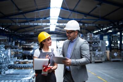 Manager, Supervisor, and Worker Collaborating on Production Results in an Industrial Factory – Free Stock Photo Download