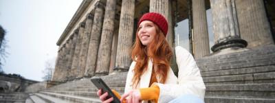 Young Urban Girl in Red Hat Sitting on Stairs Near Museum – Free Stock Photo for Download