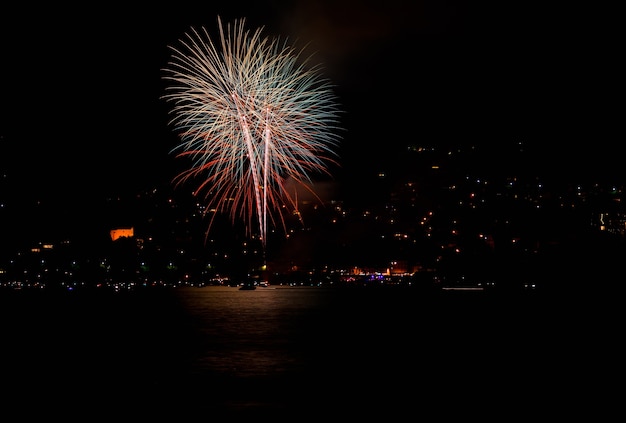 Red Fireworks Illuminating a Lake in Switzerland at Night – Free to Download